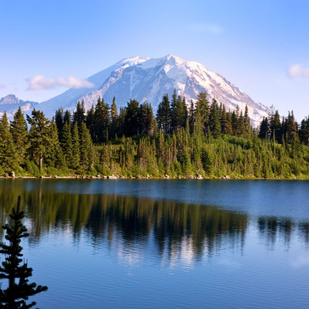 Mount Rainier in Washington, a top destination in one of the best states to travel to in 2025, showcasing its iconic snow-capped peak and lush green surroundings.