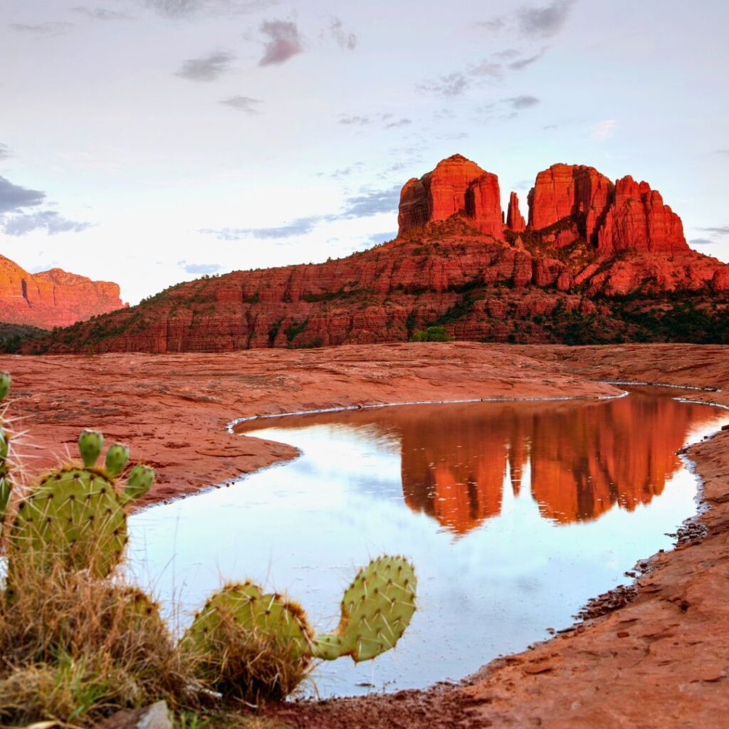 Arizona's iconic red rock formations glowing at sunset, highlighting its beauty as one of the best states to travel to in 2025.