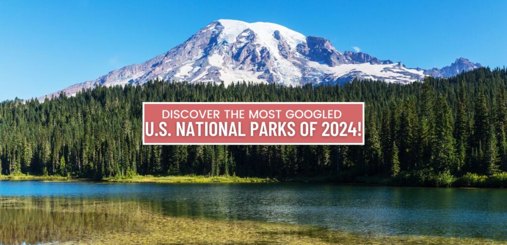 A scenic view of Mount Rainier towering over a clear summer lake, with lush greenery surrounding the water and a blue sky above. The title 'Discover the Most Googled U.S. National Parks of 2024' is displayed over the image.