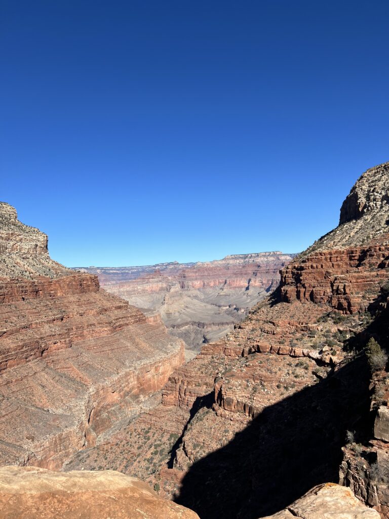 Breathtaking view of the Grand Canyon at sunrise, showcasing the rugged cliffs and vast landscapes—perfect for planning the best time to visit US National Parks.