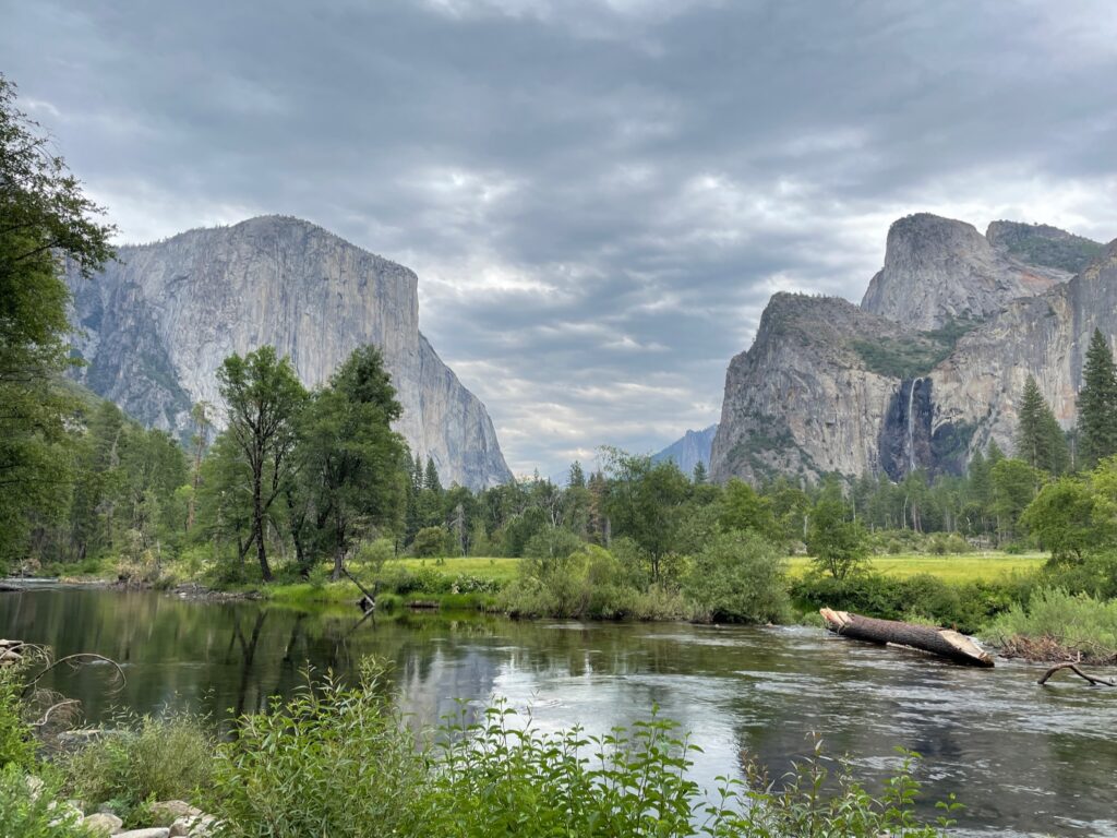 Stunning view of Yosemite Valley, highlighted in this Yosemite National Park guide, showcasing its iconic granite cliffs and lush landscapes.