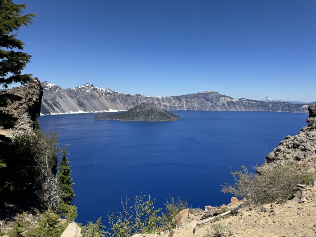 Crater Lake National Park, one of the Most Searched U.S. National Parks, featuring its iconic deep blue waters and majestic mountain views.